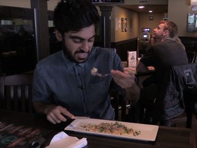 Postmedia reporter Salmaan Farooqui tries prairie oysters for the first time.