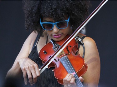 Simi Sernaker, the frontwoman of the rock band Suffrajett, joins The New Pornographers on the main stage at Calgary Folk Festival 2016 at Prince's Island in Calgary, Alta. on Thursday, July 21, 2016. Jim Wells/Postmedia