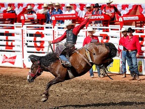 Zeke Thurston of Big Valley, Alta., wins the bareback title at the Calgary Stampede rodeo in Calgary, Alta. on Sunday July 12, 2015. Al Charest/Calgary Sun/Postmedia Network