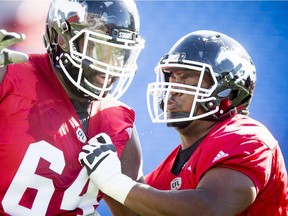 Ucambre Williams (right) works the line in practice for the Calgary Stampeders. Postmedia file