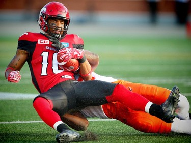 Calgary Stampeders Marquay McDaniel is tackled by Solomon Elimimian of the BC Lions during CFL football in Calgary, Alta., on Friday, July 29, 2016. AL CHAREST/POSTMEDIA