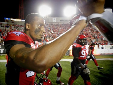 Calgary Stampeders Tommie Campbell celebrates with teammates after his interception in the endzone in overtime for a 44-41 win over the BC Lions in CFL football in Calgary, Alta., on Friday, July 29, 2016. AL CHAREST/POSTMEDIA