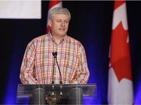 Former Prime Minister Stephen Harper speaks to attendees at the annual Calgary Conservative barbecue in Calgary, Saturday, July 9, 2016.