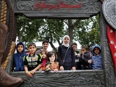Syrian refugee children enjoy their first Calgary Stampede in Calgary, Alta., on Wednesday July 13, 2016. Leah Hennel/Postmedia