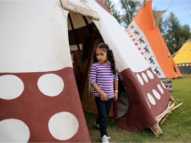 Syrian refugee Taymaa Aboud, 6, walks through indian Village at the Calgary Stampede in Calgary, Alta., on Wednesday July 13, 2016. Leah Hennel/Postmedia