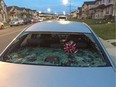 Taradale resident Cesar Zelaya's rear window of his vehicle in Calgary, Alta., on Saturday July 30, 2016, after a storm blew through Taradale. Michael Lumsden/Postmedia