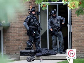 The Calgary Police Tac Unit outside an apartment on 11 Ave and 19 St NW after they arrested a man in the building.