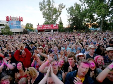 The crowd fills the grass area as Walk Off the Earth performs on the Coca Cola Stage at the Calgary Stampede in Calgary, Alta. on Friday July 8, 2016. The band picked up their first JUNO Award, winning Group of the Year honours in 2016. Jim Wells/Postmedia
