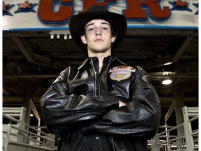 Bull rider Ty Pozzobon of Merritt, B.C., at the start of the Canadian Finals Rodeo in Edmonton on Nov. 9, 2010.