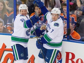 Vancouver Canucks Linden Vey (7) celebrates his goal on the Edmonton Oilers with teammate Dorsett Derek (51) during second period NHL hockey action in Edmonton, Alta., on Saturday November 1, 2014.
