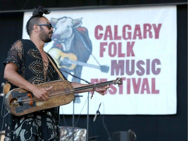 Yemen Blues with Ravid Kahalani hit the stage to open Calgary Folk Festival 2016 on the main stage at Prince's Island in Calgary, Alta. on Thursday, July 21, 2016. Saffron likes to wrap up her baby like her mother. Jim Wells/Postmedia