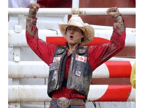 Zeke Thurston from Big Valley rides to a win in saddle bronc championship at the Calgary Stampede in Calgary on July 17, 2016. Leah Hennel/Postmedia