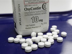 FILE - This Feb. 19, 2013, file photo, shows OxyContin pills arranged for a photo at a pharmacy in Montpelier, Vt.  (AP Photo/Toby Talbot, File)