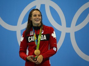 RIO-OLYMPICS-POSTMEDIA - Penny Oleksiak of Team Canada wins gold in the 100m Freestyle final during the 2016 Rio Olympics in Rio de Janeiro, Brazil on Thursday August 11, 2016. Dave Abel/Toronto Sun/Postmedia Network