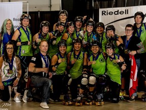 The Calgary All Stars roller derby squad shows off their gold medals, earned at the Division 2 championships in Lansing, Mi.  Photo courtesy Joe Mac/midnightmatineephotography.com