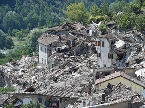 Rubble surrounds damaged buildings on August 25, 2016 in Pescara del Tronto, Italy.  Calgarian Fabio Centini is staying about 15 km from the community.