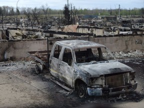 A burned out truck is shown in the Beacon Hill neighbourhood of of Fort McMurray following the May wildfires.