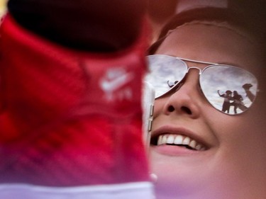 A fan looks up as Dustin Lynch struts on the catwalk as he performs at day 3 of Country Thunder at Prairie Winds Park in Calgary, Ab., on Sunday August 21, 2016. Mike Drew/Postmedia