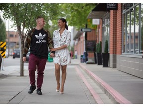 Alexandria Michael, and John Dickey walking through Bridgeland, where they bought their first home.