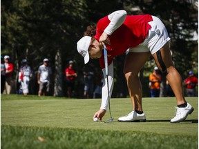 Thailand's Ariya Jutanugarn replaces her ball on the ninth green during second round action at the LPGA Canadian Open tournament in Priddis, Alta., Friday, Aug. 26, 2016.