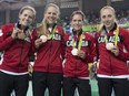 Canada's (right to left) Allison Beveridge, Jasmin Glaesser, Kirsti Lay, and Georgia Simmerling celebrate after winning the bronze medal in cycling team pursuit at the velodrome at the Olympic games in Rio de Janeiro, Brazil, Saturday, August 13, 2016.