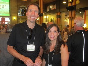 Cal 0820 Sobey 7 All smiles at   the registration reception held in Gasoline Alley at Heritage Park  for the Sobeys Better Food Fun Charity  Golf Classic are Sobeys interim president and CEO Francois Vimard with colleague Renee Hopfner. Scores of golfers took to the links at Priddis Greens the next day to take part in the fun and philanthropic tournament.