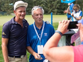 Golfer Jesper Parnevik, left, poses for a photo with a fan during the Shaw Classic RBC Championship ProAm event at the Canyon Meadows Golf Club on Aug.31, 2016.