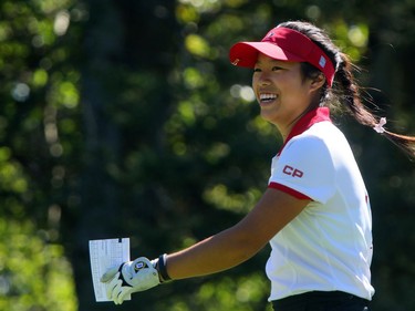 Calgarian Jaclyn Lee is all smiles after her shot from the first tee during round 2 of the Canadian Pacific Women's Open at Priddis Greens Golf and Country Club west of Calgary, Alta.,  August 26, 2016.