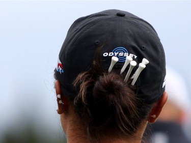 Olympic silver medalist Lydia Ko keeps her tees in her hair on the green at Priddis Greens Golf and Country Club west of Calgary, Alta.,  August 25, 2016 during the Canadian Pacific Women's Open.