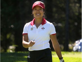 Calgarian Jaclyn Lee is all smiles after her shot from the first tee during round 2 of the Canadian Pacific Women's Open at Priddis Greens Golf and Country Club west of Calgary, Alta.,  August 26, 2016.