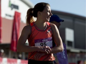 Jessica O'Connell rests after winning the women's 10-km portion of the Calgary Marathon at the Stampede Grounds in Calgary, Alta., on Sunday, May 29, 2016.