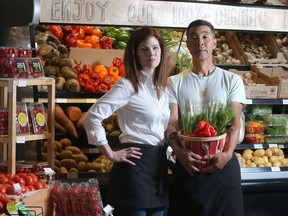 Alison Gilroy and Alan Yee, owners of Market 17, amidst the fresh produce at their Killarney area store Wednesday August 3, 2016. They are among the many Calgary businesses adjusting to the recession.