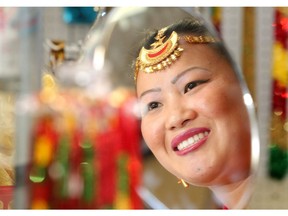 Sunita Rai wears a shirbandi jewelled tiara in her Gorkha Department Store in Lethbridge, a southern Alberta city that's home to the largest community of Bhutanese immigrants in the country.