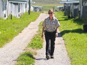 Zoo keeper Valerie Edwards walks in the crane area at the Calgary Zoo's Devonian Wildlife Conservation Centre southwest of Calgary on Tuesday August 16, 2016. Whooping Cranes and Sandhill Cranes are among several endangered animals that are bred at the centre. Gavin Young/Postmedia