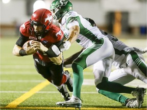 Calgary Stampeders quarterback Andrew Buckley runs for a touchdown against the Saskatchewan Roughriders during CFL action in Calgary on Aug. 4, 2016.