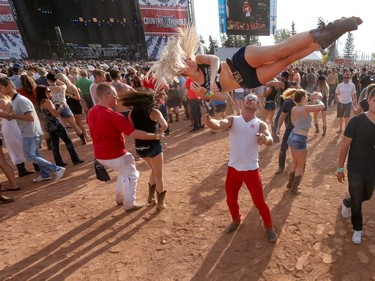 Dancers kick up the dust as Dustin Lynch performs at day 3 of Country Thunder at Prairie Winds Park in Calgary, Ab., on Sunday August 21, 2016. Mike Drew/Postmedia