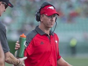 Calgary Stampeders head coach Dave Dickenson looks on as his team takes on the Saskatchewan Roughriders during the first half of CFL football action in Regina on Saturday, August 13, 2016.