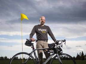 David Robertson, who will be competing in his sixth Enbridge Ride to Conquer Cancer, poses for a photo with his bike and gear near his home in Calgary, on August 2, 2016. This year Robertson will be competing as both a survivor and a patient, as he has been diagnosed again with brain cancer. -- (Crystal Schick/Postmedia)