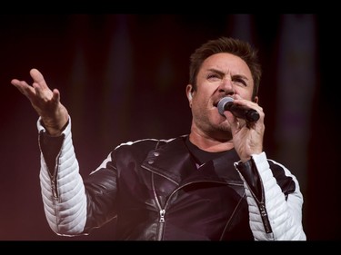 Simon Le Bon leads a Duran Duran concert at the Scotiabank Saddledome in Calgary, Alta., on Tuesday, Aug. 30, 2016. They were on the road in support of their 14th studio album Paper Gods. Lyle Aspinall/Postmedia Network