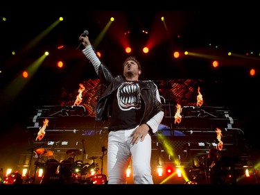 Simon Le Bon leads a Duran Duran concert at the Scotiabank Saddledome in Calgary, Alta., on Tuesday, Aug. 30, 2016. They were on the road in support of their 14th studio album Paper Gods. Lyle Aspinall/Postmedia Network