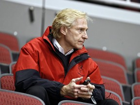 FILE - In this Jan, 15, 2013, file photo, Phoenix Coyotes general manager Don Maloney watches his team during NHL hockey practice in Glendale, Ariz. The NHL rewarded Maloney on Friday, May 24, 2013, signing the him to a long-term contract that will keep him with the franchise no matter where it ends up playing.