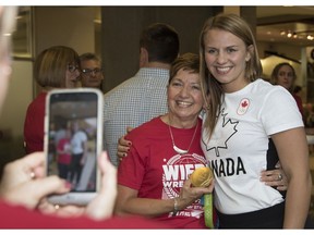 Olympic gold medal wrestler Erica Wiebe returns to Calgary and is greeted by family, friends and fans at the Air Canada arrivals terminal, on August 26, 2016.
