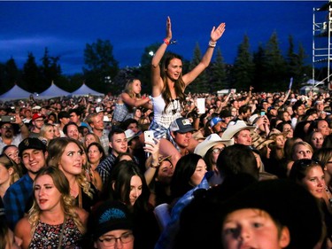 Fans cheer as Tim McGraw closes out day 2 of Country Thunder at Prairie Winds Park in Calgary, Ab., on Saturday August 20, 2016. Mike Drew/Postmedia