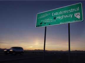 A car moves along the Extraterrestrial Highway near Rachel, Nevada, in this Wednesday, April 10, 2002 file photo.