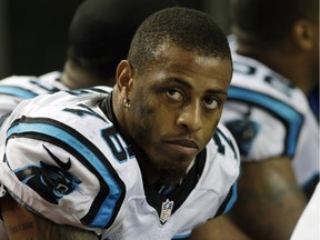 Carolina Panthers defensive end Greg Hardy (76) sits on the bench during the second half of an NFL game against the Atlanta Falcons in Atlanta on Dec. 29, 2013.