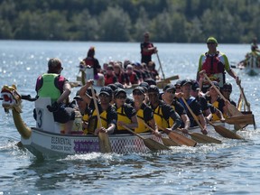 A team of dragon boat racers finishes their heat at the 25th annual Calgary Dragon Boat Race & Festival at North Glenmore Park in Calgary, Alta., on Sunday, Aug. 14, 2016. Elizabeth Cameron/Postmedia