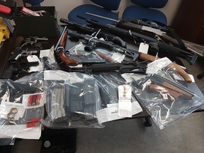 Sylvan Lake RCMP display weapons seized during the execution of a search warrant at a home on Richfield Crescent.