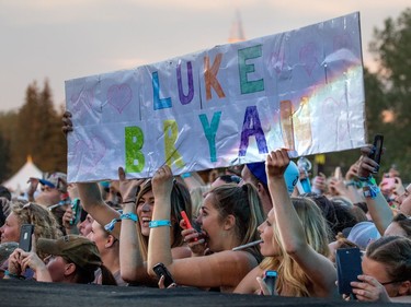 Happy Luke Bryan fans look on as he walks the catwalk at day 3 of Country Thunder at Prairie Winds Park in Calgary, Ab., on Sunday August 21, 2016. Mike Drew/Postmedia