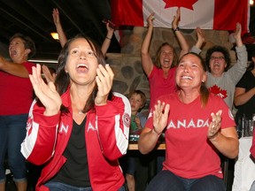 Helen Hennick, Christine Nordhagen cheer on Canada's Erica Wiebe at the Riverstone Pub in northwest Calgary, Alta on Thursday August 18, 2016. Wiebe won a gold medal in wrestling in the Olympic Games in Rio.