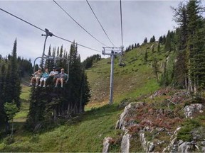Hikers take the Mt. Standish chairlift down the slopes after hiking the trails in Sunshine Meadows.